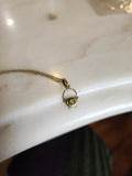 Tiny cauldron necklace + Peridot